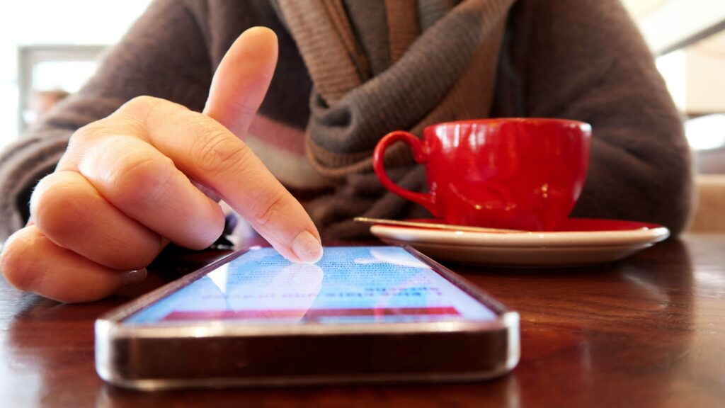 lady scrolling through the phone, indicating high screen time